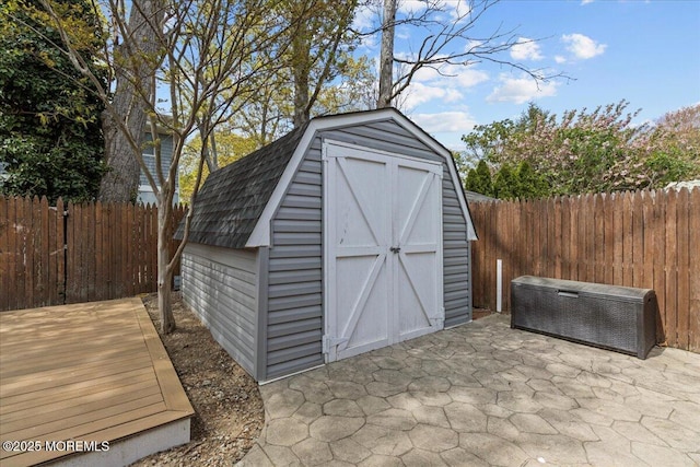 view of shed featuring a fenced backyard