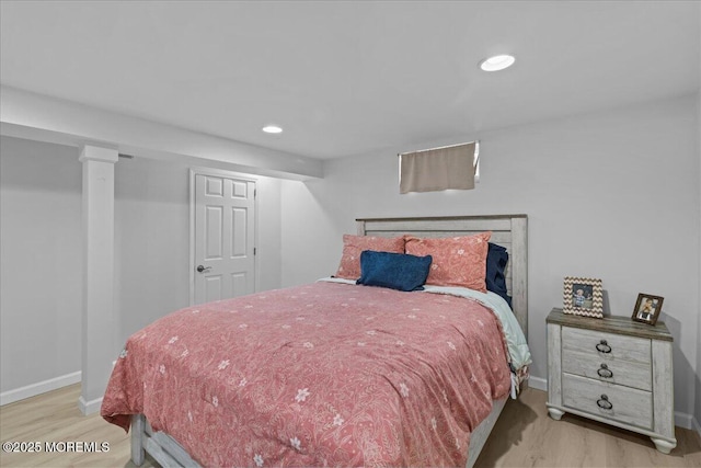 bedroom with baseboards, recessed lighting, and wood finished floors