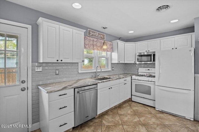kitchen featuring a sink, plenty of natural light, visible vents, and appliances with stainless steel finishes