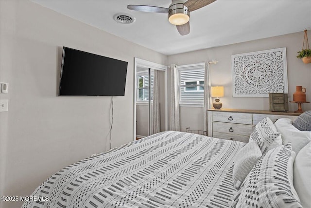 bedroom with a ceiling fan and visible vents