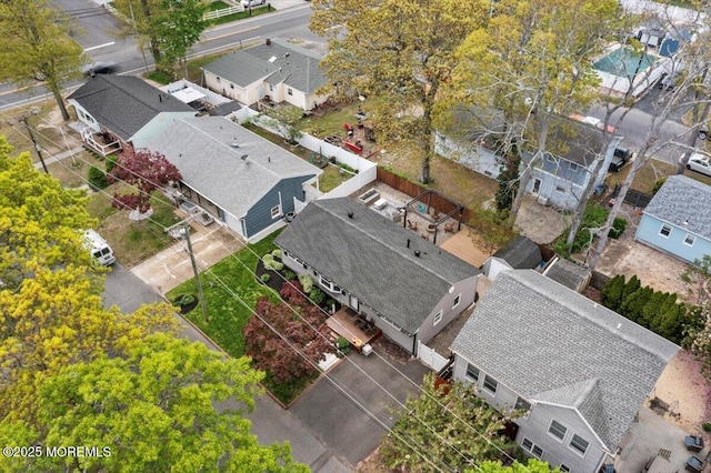 birds eye view of property with a residential view