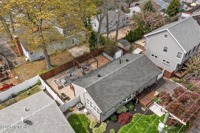 birds eye view of property with a residential view