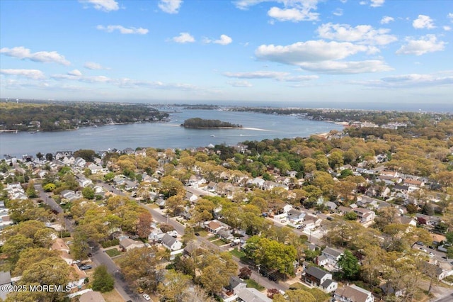 birds eye view of property featuring a water view and a residential view