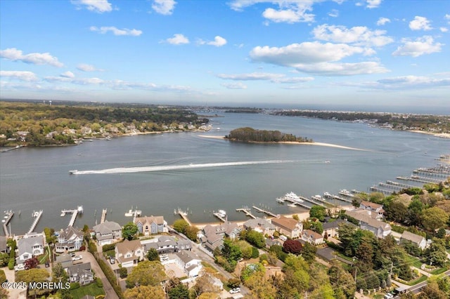 birds eye view of property with a water view and a residential view