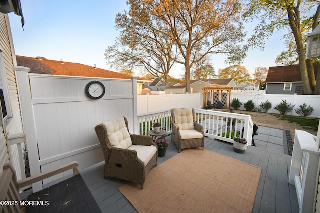deck with a fenced backyard