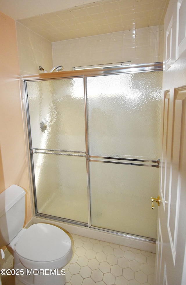 126 Cardigan Ct, Manchester, NJ 08759 - full bathroom featuring toilet, a shower with door, and tile patterned floors