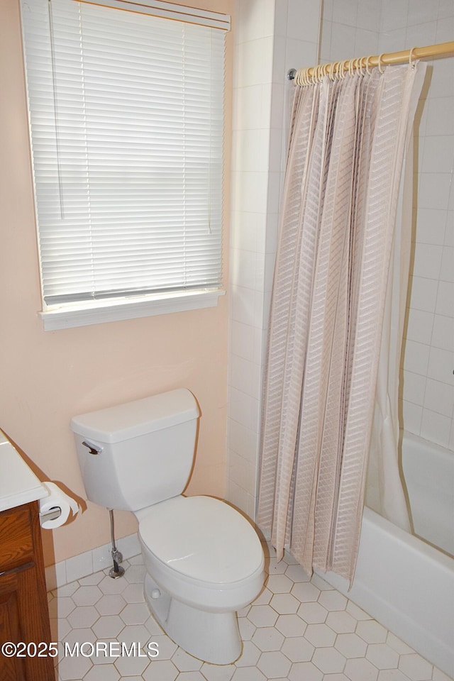 126 Cardigan Ct, Manchester, NJ 08759 - bathroom featuring vanity, toilet, shower / tub combo with curtain, and tile patterned floors