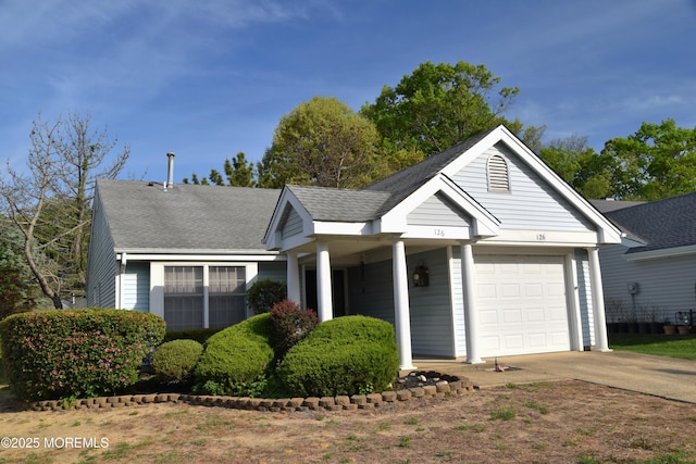 126 Cardigan Ct, Manchester, NJ 08759 - single story home with an attached garage, concrete driveway, roof with shingles, and covered porch