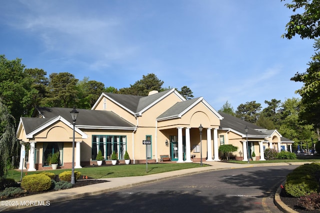 126 Cardigan Ct, Manchester, NJ 08759 - neoclassical / greek revival house with stucco siding and a front yard