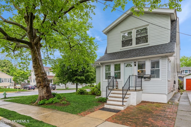 1118 Jeffrey St, Asbury Park, NJ 07712 - view of front of property featuring roof with shingles and a front yard
