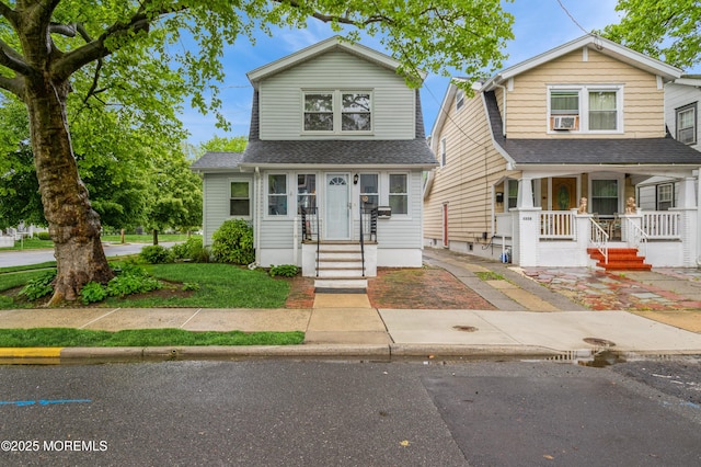 1118 Jeffrey St, Asbury Park, NJ 07712 - view of front of property with a porch and a shingled roof