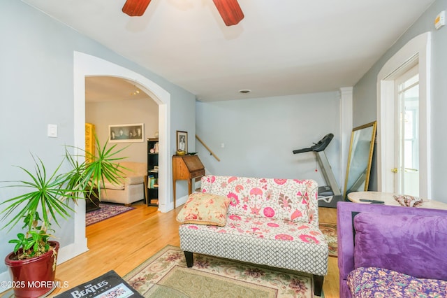 1118 Jeffrey St, Asbury Park, NJ 07712 - living area featuring light wood-style flooring, a ceiling fan, and arched walkways