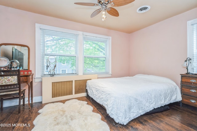 1118 Jeffrey St, Asbury Park, NJ 07712 - bedroom featuring wood finished floors, baseboards, and radiator