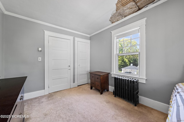 unfurnished bedroom featuring crown molding, light colored carpet, radiator, and baseboards