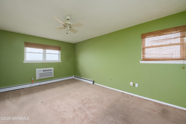 carpeted empty room with a ceiling fan, baseboards, and an AC wall unit