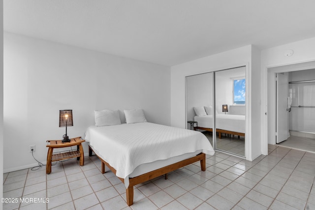 55 Ocean Ave Unit 3L, Monmouth Beach, NJ 07750 - bedroom with a closet, light tile patterned floors, and baseboards