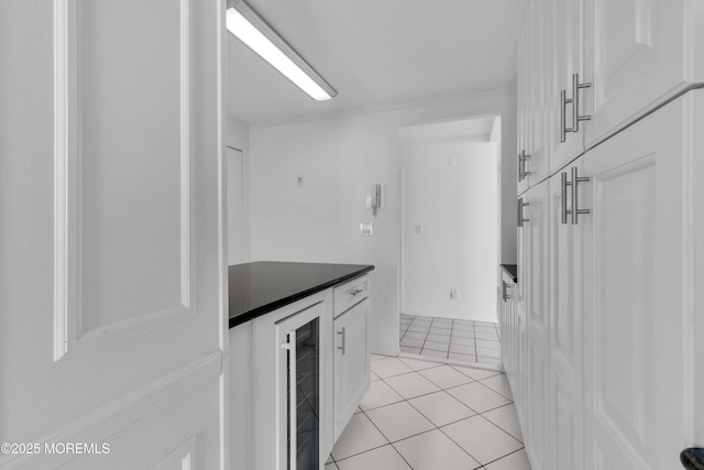 55 Ocean Ave Unit 3L, Monmouth Beach, NJ 07750 - bar featuring beverage cooler, light tile patterned floors, and crown molding