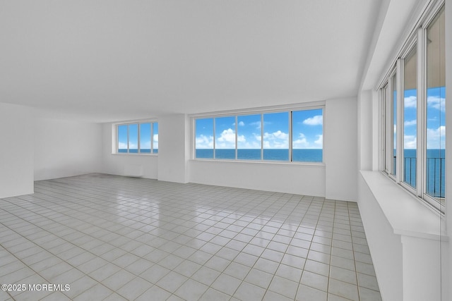 55 Ocean Ave Unit 3L, Monmouth Beach, NJ 07750 - spare room featuring a water view and light tile patterned floors
