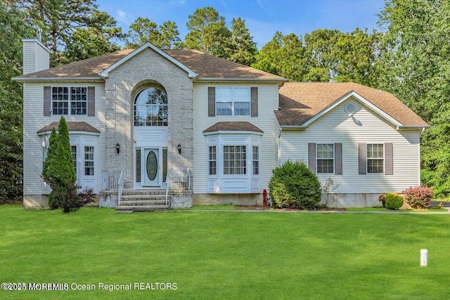 3688 Ridgeway Rd, Manchester, NJ 08759 - colonial house with a front yard, a chimney, and roof with shingles