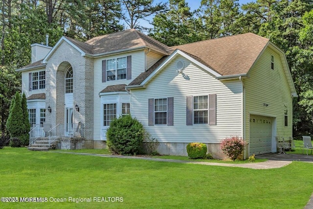 3688 Ridgeway Rd, Manchester, NJ 08759 - view of front facade with a garage, a front yard, roof with shingles, a chimney, and driveway
