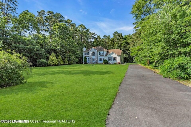 3688 Ridgeway Rd, Manchester, NJ 08759 - colonial-style house with a front lawn and asphalt driveway