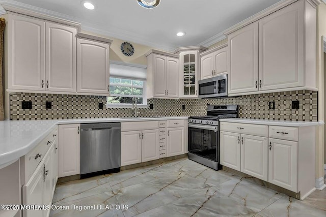 3688 Ridgeway Rd, Manchester, NJ 08759 - kitchen with appliances with stainless steel finishes, light marble finish flooring, a sink, light countertops, and tasteful backsplash