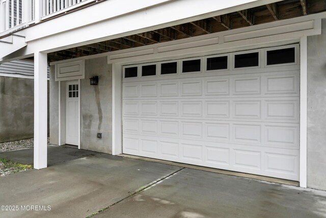 garage with concrete driveway