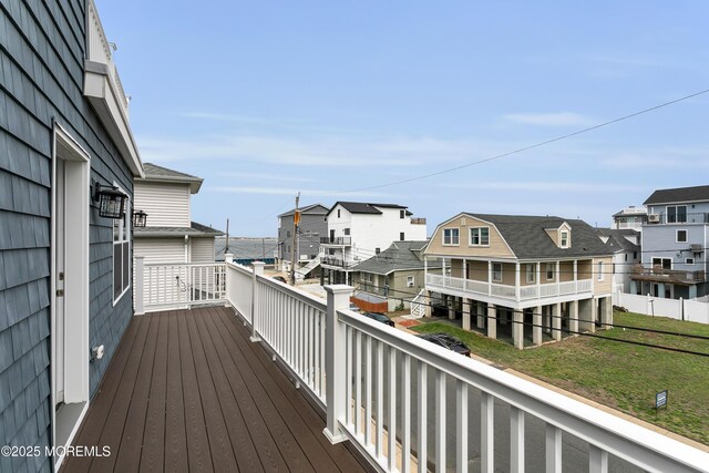 wooden deck featuring a residential view
