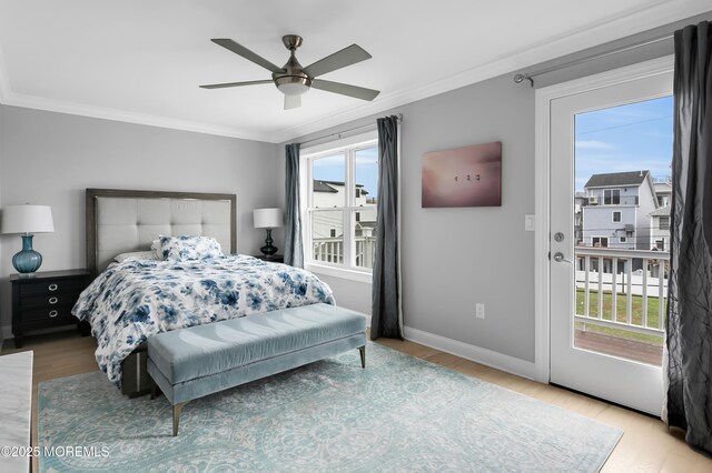 bedroom with wood finished floors, ornamental molding, baseboards, and ceiling fan