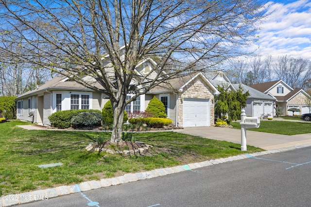 12 Rye Ct, Jackson, NJ 08527 - view of front facade featuring concrete driveway, stone siding, a front lawn, and a garage