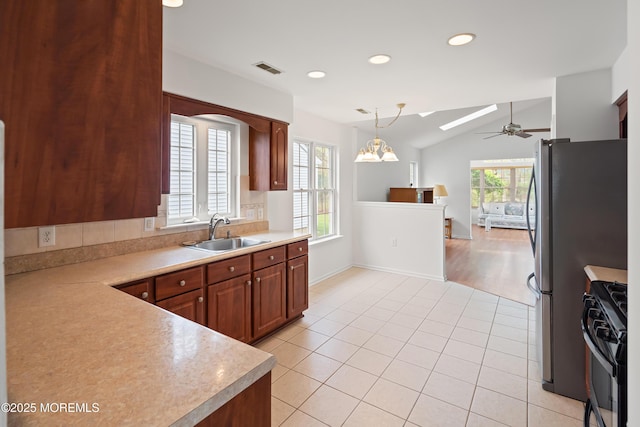 12 Rye Ct, Jackson, NJ 08527 - kitchen with black gas stove, light countertops, ceiling fan, and a sink