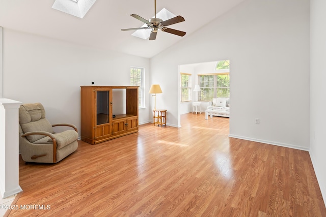 12 Rye Ct, Jackson, NJ 08527 - living area featuring light wood-type flooring, a ceiling fan, a skylight, and high vaulted ceiling