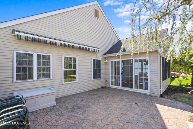 12 Rye Ct, Jackson, NJ 08527 - back of property with a patio and roof with shingles