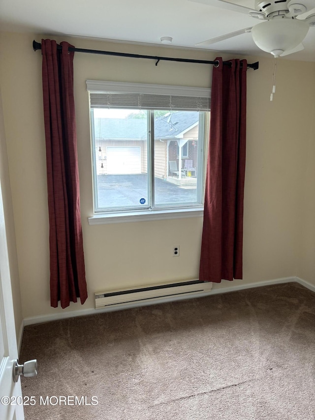 68D Yorktowne Pkwy, Whiting, NJ 08759 - carpeted empty room featuring a baseboard heating unit and ceiling fan