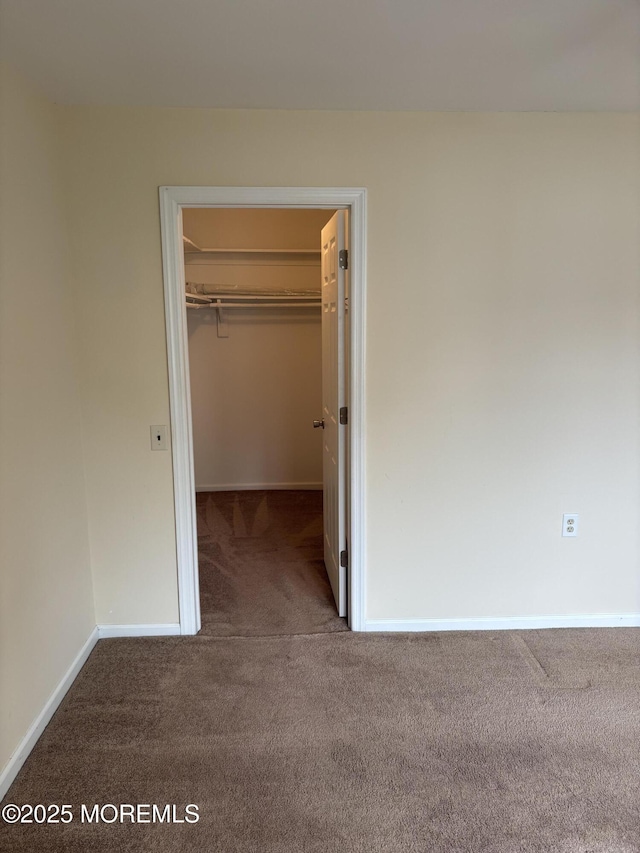 68D Yorktowne Pkwy, Whiting, NJ 08759 - unfurnished bedroom featuring a spacious closet, carpet floors, baseboards, and a closet