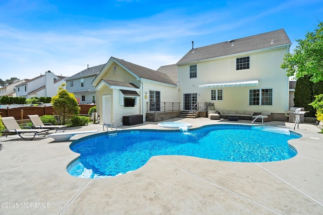 view of swimming pool featuring a patio, area for grilling, fence, and an outdoor living space