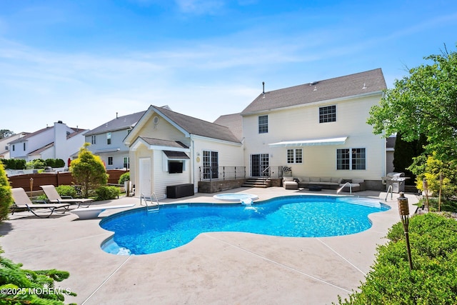 view of swimming pool featuring a patio area, fence, a grill, and an outdoor hangout area