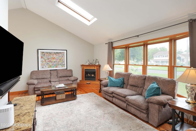 2 Nassau Pl, Middletown, NJ 07748 - living area with lofted ceiling, wood finished floors, a skylight, and a fireplace