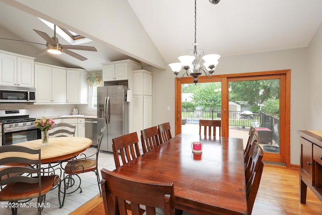2 Nassau Pl, Middletown, NJ 07748 - dining room with vaulted ceiling, light wood-style flooring, a ceiling fan, a chandelier, and a skylight