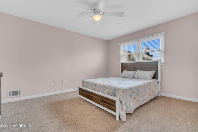 bedroom with carpet floors, baseboards, and ceiling fan