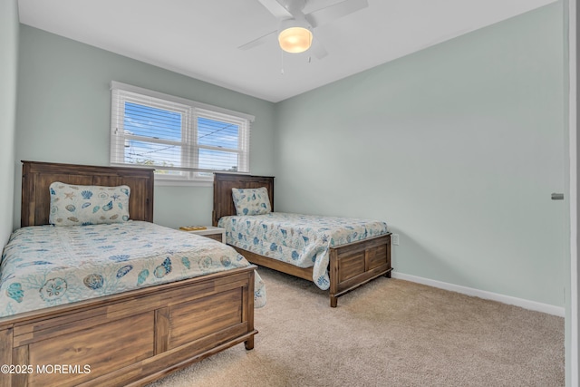 bedroom with carpet floors, baseboards, and a ceiling fan