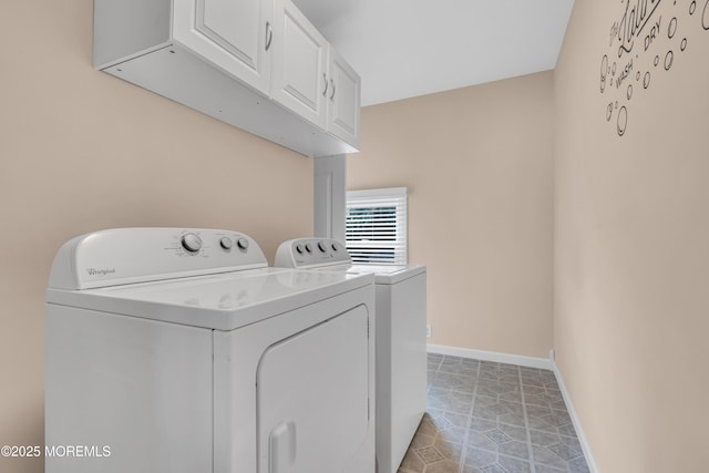 laundry room with cabinet space, independent washer and dryer, and baseboards
