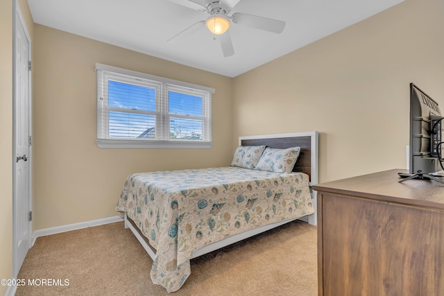 bedroom with carpet flooring, baseboards, and ceiling fan