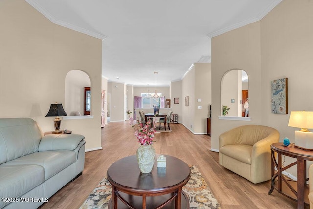 63 Merion Ln, Jackson, NJ 08527 - living area featuring crown molding, a chandelier, light wood finished floors, and baseboards