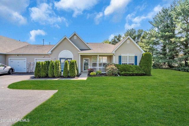 32 Sunnybrook Ln, Lakewood, NJ 08701 - ranch-style home with a garage, a front yard, a porch, concrete driveway, and a shingled roof