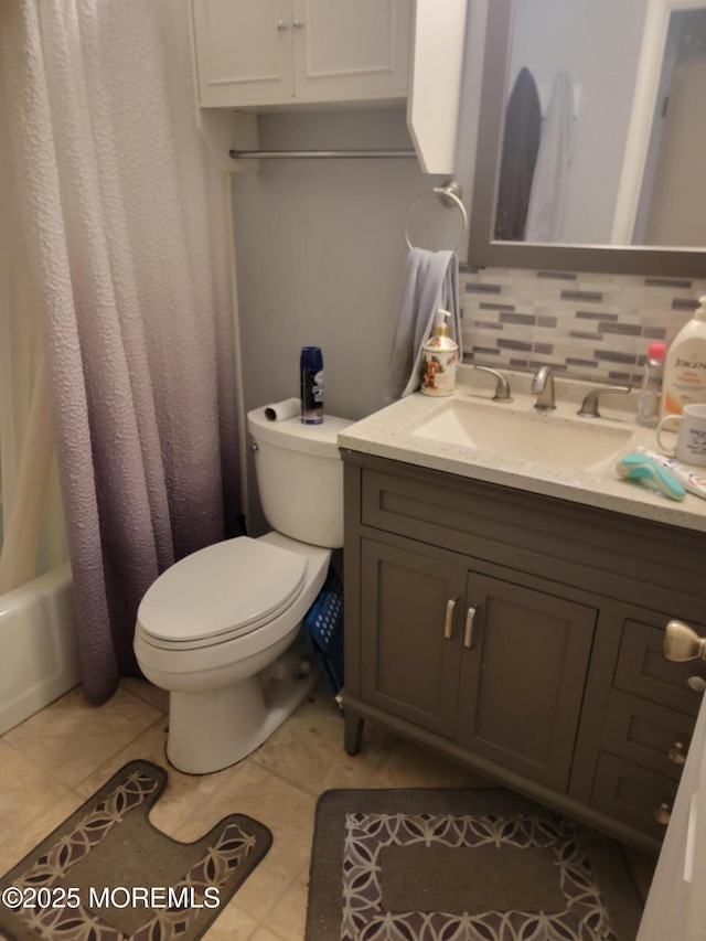 bathroom featuring toilet, shower / bathtub combination with curtain, tasteful backsplash, and vanity