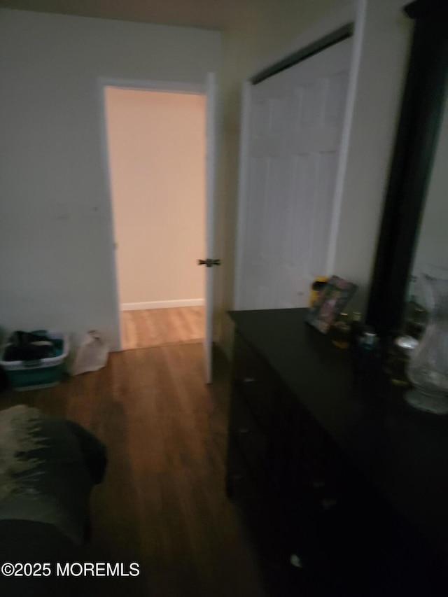 hall with wood finished floors