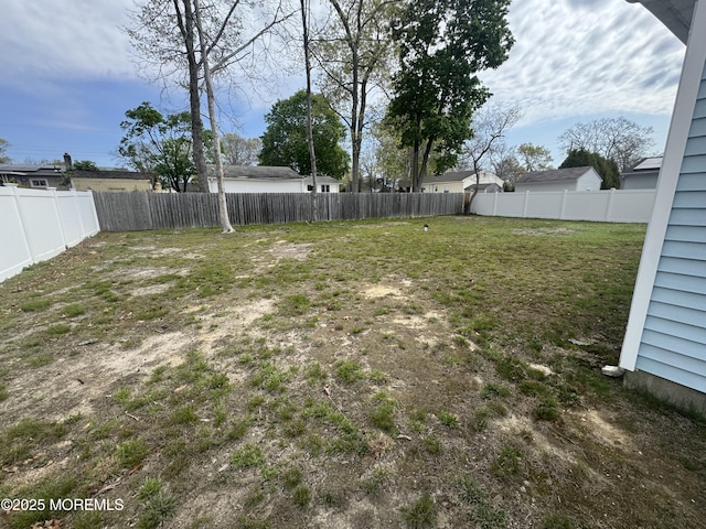 view of yard featuring a fenced backyard