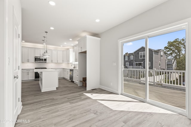 204 Morningside Ave, Union Beach, NJ 07735 - kitchen featuring stainless steel appliances, a sink, light wood-style flooring, light countertops, and recessed lighting