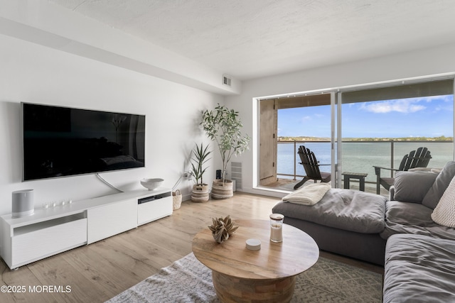 138 Bodman Pl Unit 5, Red Bank, NJ 07701 - living area with wood finished floors and a water view